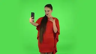 Pretty Young Woman Is Talking for Video Chat Using Mobile Phone and Rejoice  Green Screen