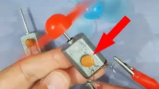Why is a capacitor used with DC motors in toys?