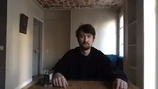 Man sits at a desk doing nothing for 9 hours
