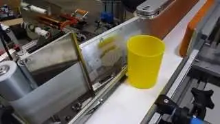 Labelling system for conic container
