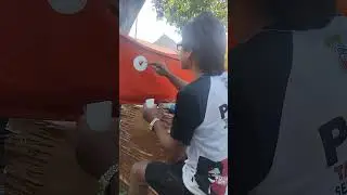 Lettering freehand on boat