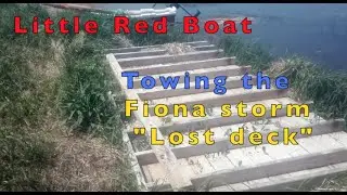 Electric boat towing a deck
