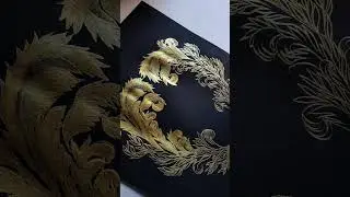 Black and gold ornate crest inspired for a custom wedding invitation suite.