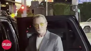 Daniel Craig Steps Out Of His Car At A Stop Sign