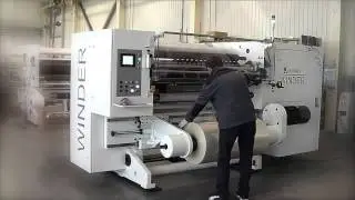 Shaftless unwind including lifting of parent roll  / załadunek rolki matki