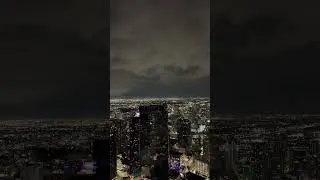 Gigantic thunderstorm above the city at night
