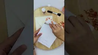 Gold leaf edges on wedding invitation