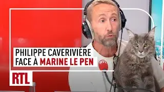 Philippe Caverivière, et son chat, face à Marine Le Pen