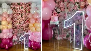 Balloon Columns With Pink Flower Wall