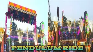 People Enjoying Santiniketan Pouse  Mela Pendulum Ride