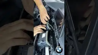 Removing the OEM stereo and navigation system from a BMW X3.