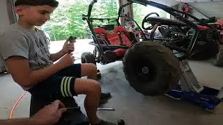 HD spindle install Colman kt 196 gokart  front tire removed and spindle replaced