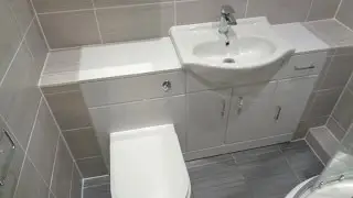 Bathroom converted to a shower room with vanity bathroom storage