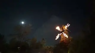 Frankenstein windmill a blaze. Full moon and lightning strikes. (Epic universe burning blade tavern)
