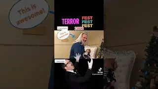 Robert Mukes holding the baby at Conroe's TerrorFest 2022 | Rufus House of a Thousand Corpses