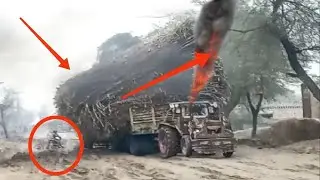 Powerful Tractor Trailer and muddy road pulling heaviest Sugar Cane Knot Trailer