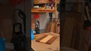 Sanding and raising the grain of the maple and walnut charcuterie board with built in cheese slicer