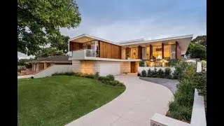 Contemporary House Design With Retro Style and Large Glass Wall
