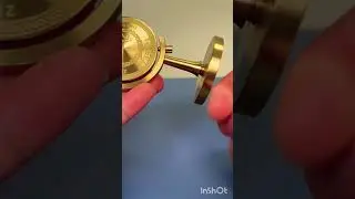 Made of pure brass, this is a small goal of 100 million ornament.