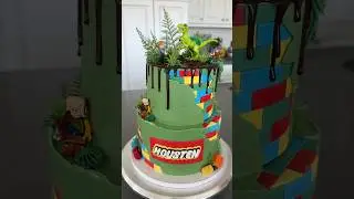Jurassic Cake Decorated with LEGOs & Lightsabers?! 🦖 #cake #cakedecorating #lego #dinosaur