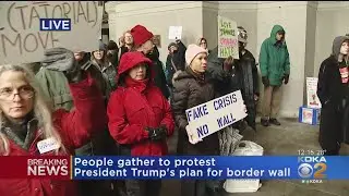 Protesters Rally Against Border Wall On City-County Building Steps