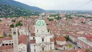 Brescia, Italy. Cathedral of Santa Maria Assunta. Flight over the city in cloudy weather, Aerial Vie