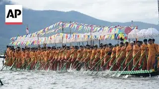 Teams race boats across Myanmar lake for Buddhist religious celebrations
