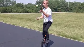 World's First Juggling Rubik's Cube Solve on a Unicycle