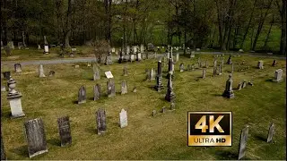 1777 West Arlington Cemetery in Arlington, Vermont. A 4k Drone Fly Through on a Cloudy Spring Day.