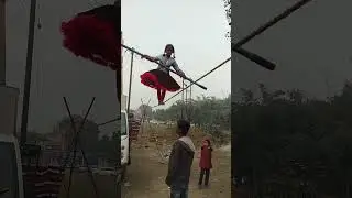 The girl is walking on the rope