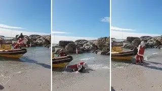Hilarious Moment Santa Caught Falling Off Front Of Boat