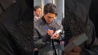 Taylor Zakhar Perez and Nicholas Galitzine signing autographs for fans