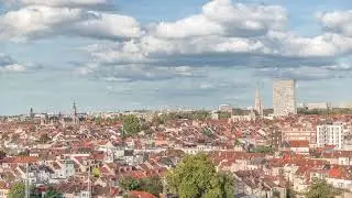 Aerial timelapse panorama over Brussels skyline in Schaerbeek with Saint-Servais Church and Town