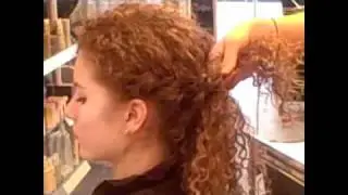 Platinum Salon Demonstrates a Side Braid Bun Updo