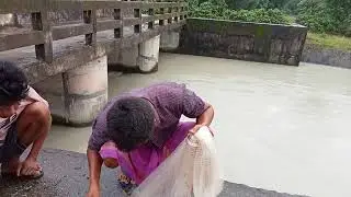 Amazing Boro traditional catching up fish with the net in the laoti river in Chirang Bodoland Assam.