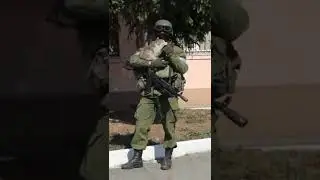Russian soldier playing with a cat in Ukraine