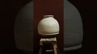 Handbuilding a vase in the coil technique using stoneware clay.