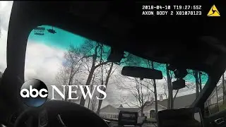 Police cam shows officers circling the parking lot where teen died in his car