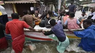India flooding: Rescuers wade into submerged villages, searching for survivors