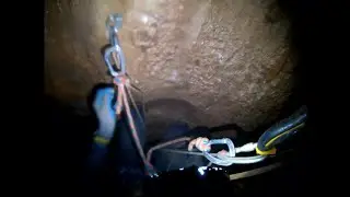Passing Rebelays in a cave ascending and rappelling