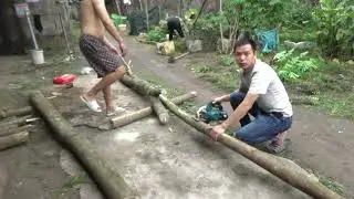 Sawing tree trunks with a sliding saw