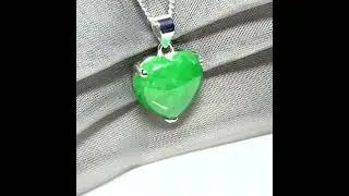 A real green jade pendant heart shape sterling silver necklace with a chain