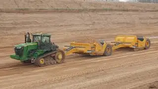 John Deere 9570RT and 2412DE scrapers loading sand
