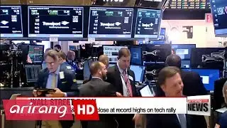 Wall Street share indexes close at record high on strong corporate earnings