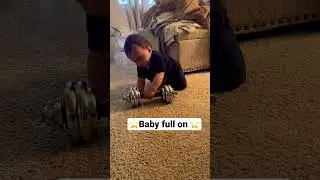 Baby and the dumbbell