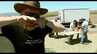Adam Savage mocking Jamie Hyneman while Jamie Hyneman prepares a hobo meal for Adam Savage