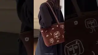 Stylish Suede Tote Bag with Unique Abstract Face Design