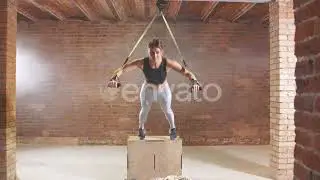 Exercise With Hanging Straps Trx. Girl Engaged in Sports Tight in Gym on Belt Trx. | Stock Foota...