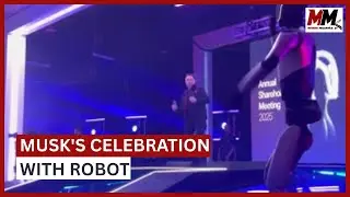 Elon Musk dances on stage with humanoid robot Optimus