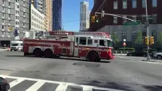 STUPID MORONIC IDIOT TRYING TO BEAT FDNY LADDER 110 ACROSS INTERSECTION WHILE RESPONDING IN BKLYN.